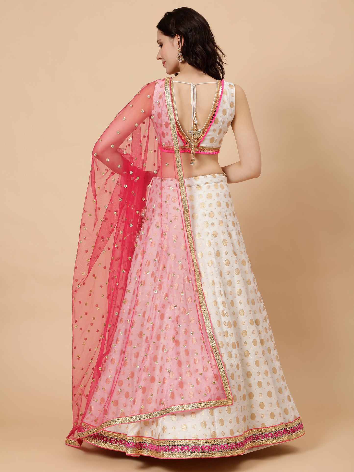 White silk lehenga with zari booties and Pink chunni